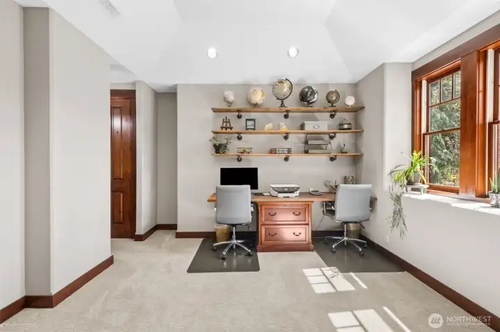 Back inside, and tucked just off the entry, the main-floor office creates a comfortable, light-filled space for working from home—offering both convenience and separation from the primary living areas.