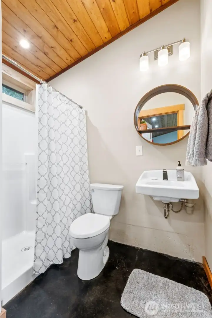 Guest bathroom, tucked behind the kitchen for privacy.