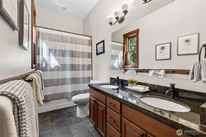 At the opposite end of the house, conveniently located near the other bedrooms on the main-level is a full bathroom.
