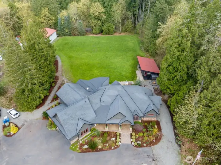 Set on 10 beautiful acres, this remarkable estate includes the main home, extensive outdoor living spaces, a detached cabana/ADU studio, additional lawn and garden areas, and a substantial 1,600 sq ft detached shop.