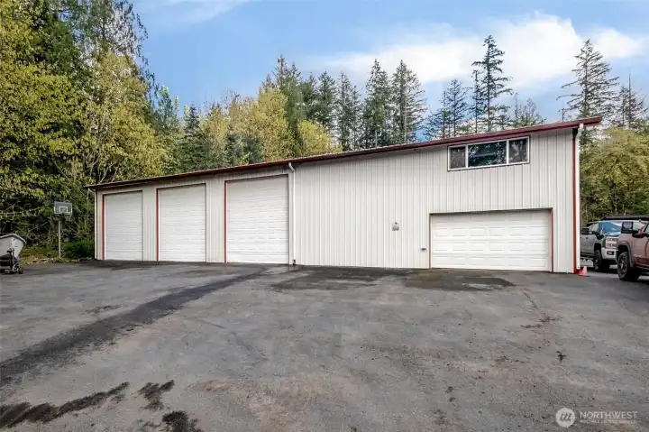 The impressive 20' x 80' detached shop offers exceptional utility, featuring multiple bay doors, a mezzanine level for additional storage, and a fully finished upper-level office complete with two private workspaces and a bathroom—ideal for business, hobbiest (car lovers!?) or large-scale projects.