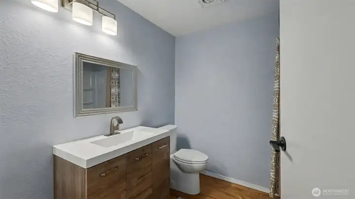 Large bathroom with tub/shower combo.