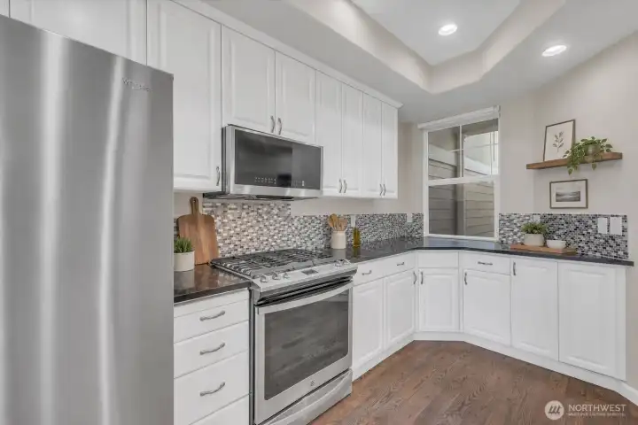 Beautiful kitchen with granite counters and stainless appliances.