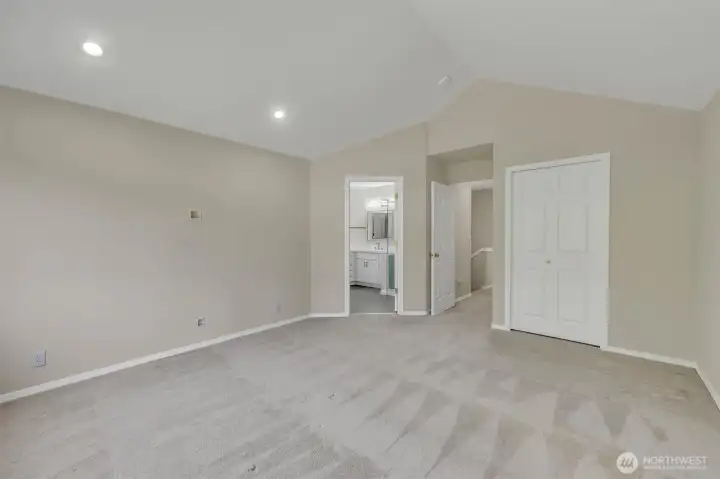 Primary bedroom with 2 closets including the walk-in off the bathroom