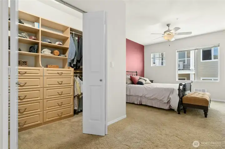 The primary bedroom with a walk-in closet with built-ins.