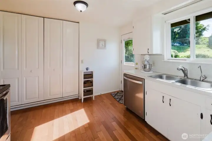 Kitchen with huge pantry and stainless steel appliances