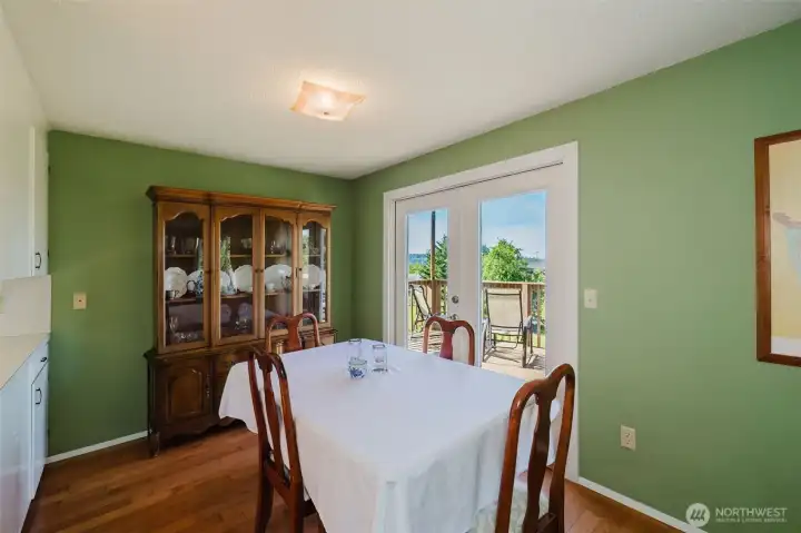 Formal dinving room with french doors to enormous deck