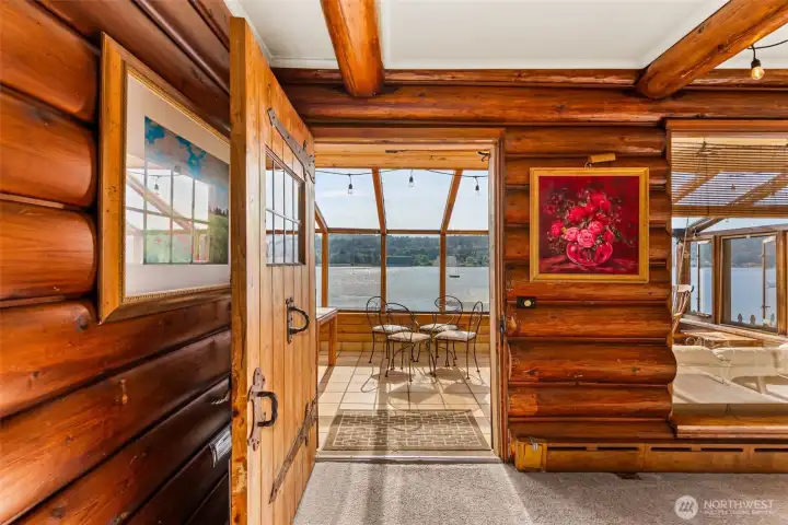 The door from living room leads to a wam and bright solarium.