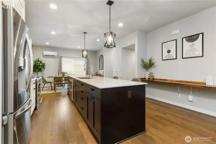 Added custom wood shelf on wall adjacent to kitchen island. Flexible work space. Added custom wood shelf on wall adjacent to kitchen island. Flexible work space.