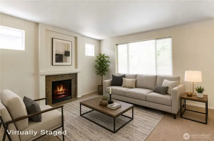 Living room has a granite tiled surround and coffered mantle