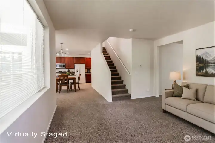 The living room is open to the dining area and kitchen.