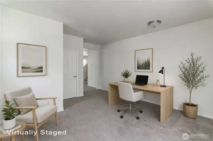Front entry has an open den area.