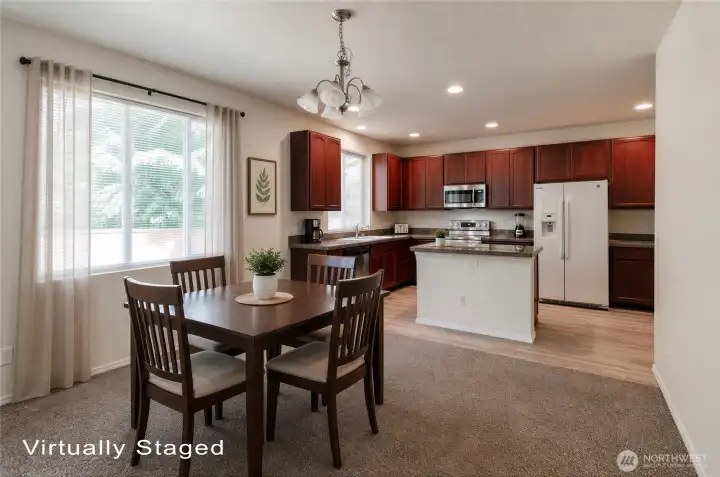 Kitchen island offers additonal casual eating area.