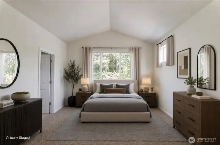 The primary suite is privately situated away from the other two bedrooms and offers vaulted ceilings, a large walk-in closet and ensuite, complete with garden tub.