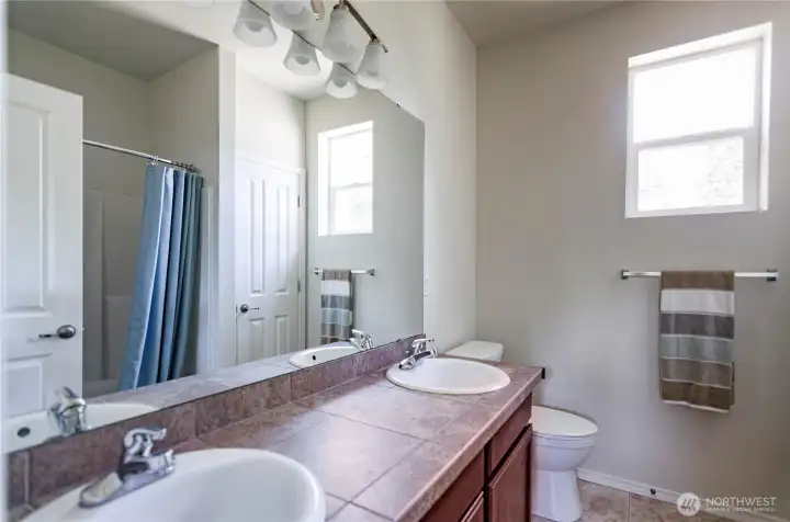 Primary bath has double sinks and garden tub/shower.
