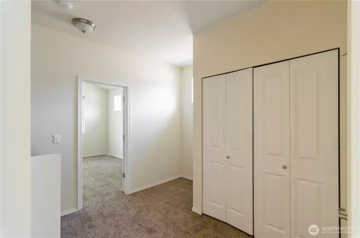 Upper level hallway has a nook, perfect for a small workspace or reading nook.