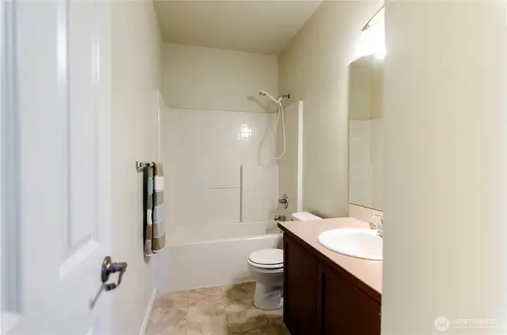 Hall full bath is centrally located upstairs.