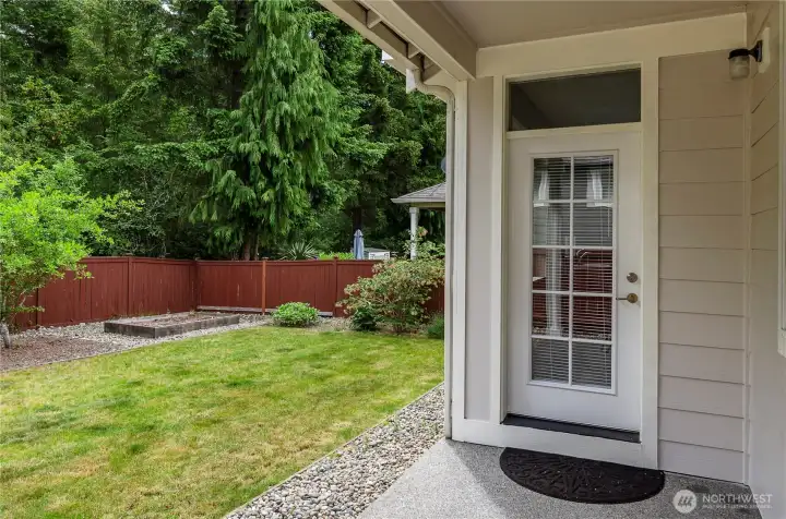 Level back fully fenced yard with garden space.