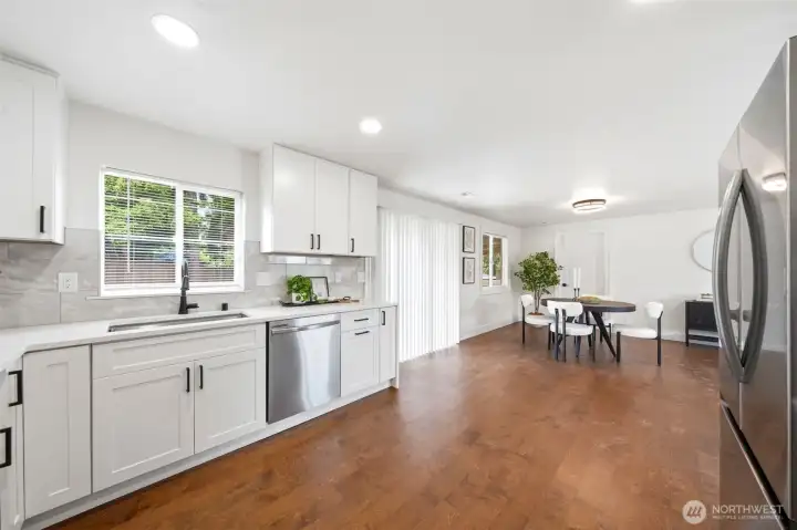 Kitchen window, patio window, dining window bring lots of natural light inside
