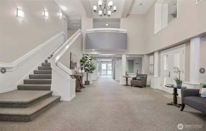 Entry to building leads to common area room & mail.