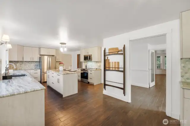 Entertain guests and never miss a conversation. This kitchen is the hub of this home. Show off your collection of Charcuterie boards or vintage platters on this built in rack.