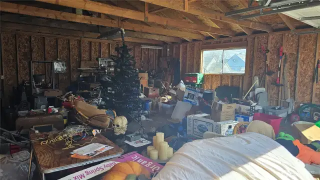 Double garage interior to be cleaned up.