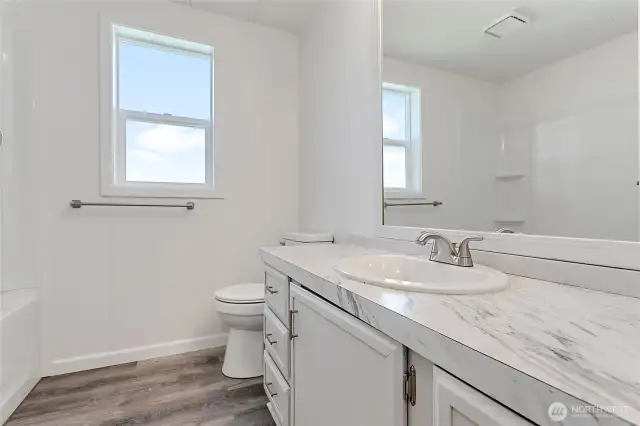 One of two full bathrooms