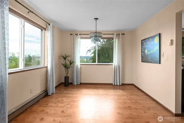 Spacious dining room with views of back yard and Penn Cove.