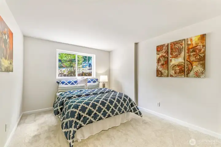 Sun-lit second bedroom enjoys brand-new carpet and a leafy outlook—perfect for guests or a home office.