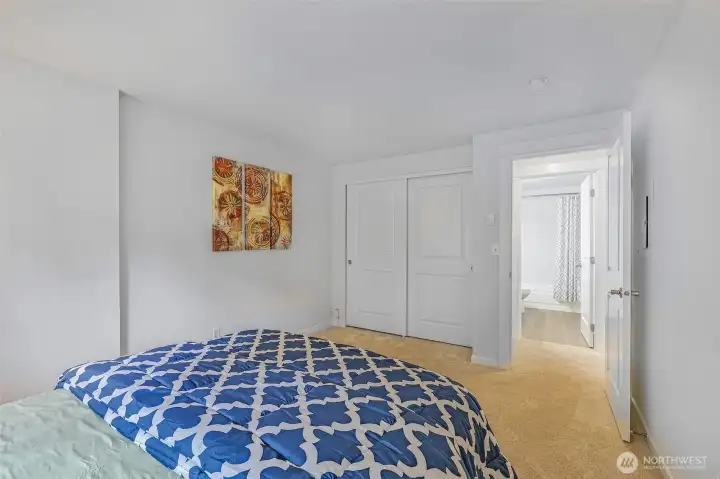 Alternate perspective highlights the second bedroom’s full-length closet and convenient hall-bath access, underscoring the smart use of every square foot in this 930 SF home.