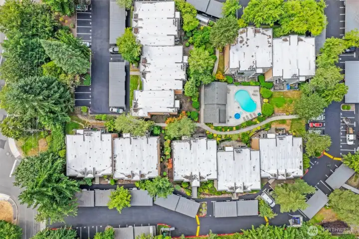 Bird’s-eye view pinpoints the home within Mira’s beautifully landscaped complex, revealing winding drives, well-lit carports, and the residents’ pool and spa—amenities that enrich everyday living just blocks from downtown Kirkland.