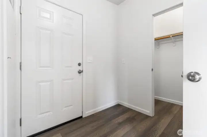 Full walk in closet off the laundry room and back door.