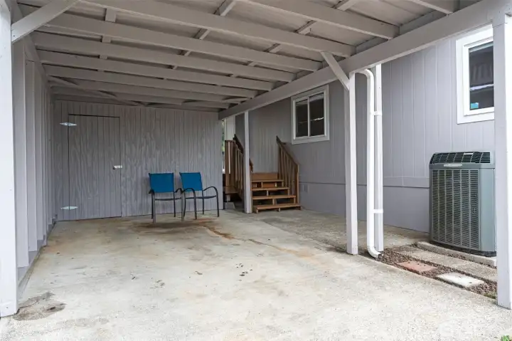 Covered parking with storage shed included.