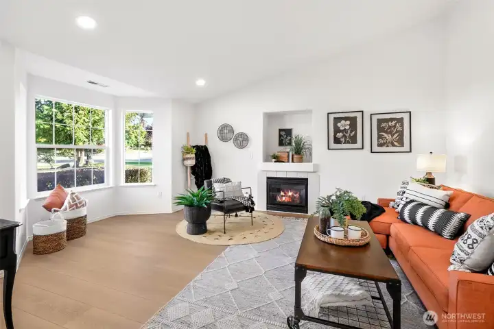 Enter the main living room that has brand new LVP flooring and interior paint.