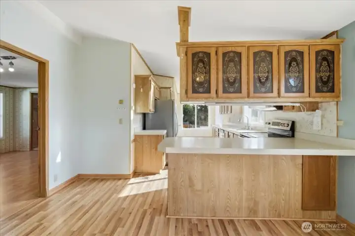 View of kitchen with eat-in space at the bar.
