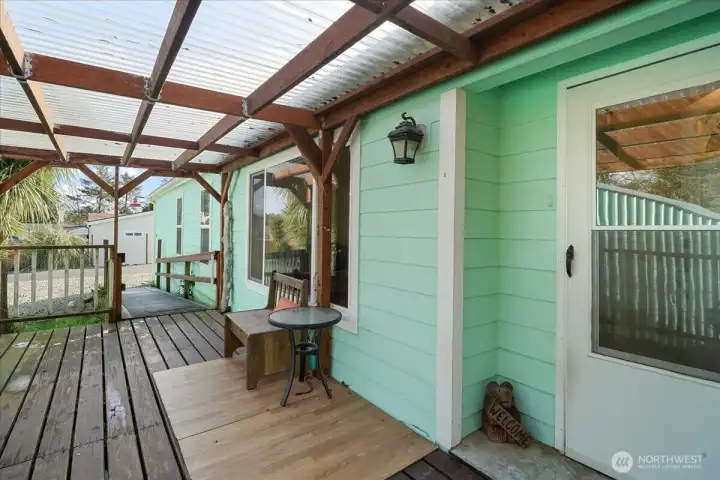 Front door leads to fully covered deck.
