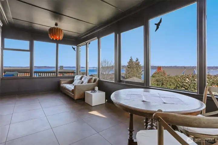 The Sun Room features walls of windows to enjoy the expansive views.  It has newer in-floor radiant heating with attractive tile flooring.