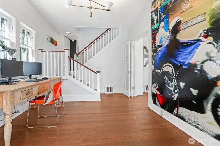 Currently used as a home office, this space could be a perfect hobby room, den or play space.