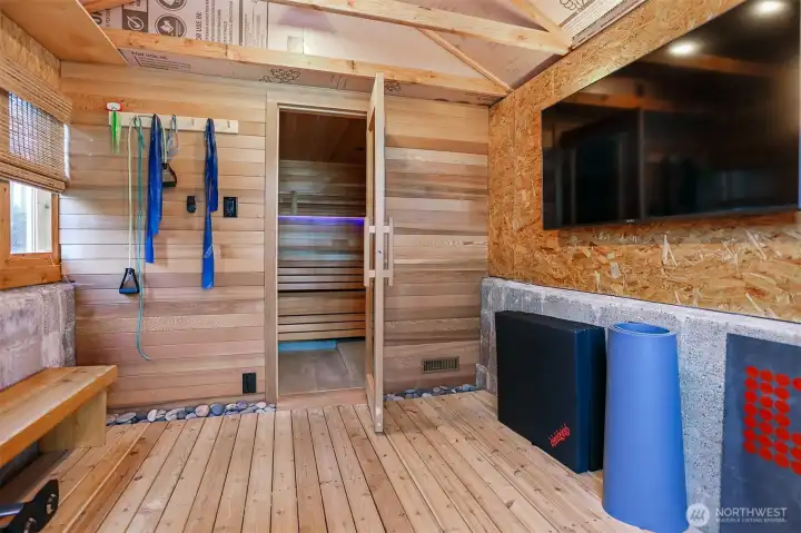 This unique space is hidden from plain site.  Detached from the main house, you enter through the Greenhouse into your own personal Yoga room and Sauna!