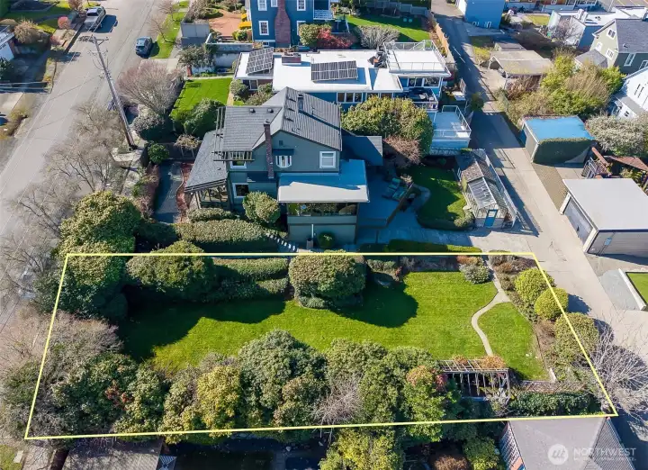 The extra 6,000 sf. ft. lot has just been surveyed and stakes are in the ground to see the boundaries. Build a DADU or a pickleball court!  So many options!