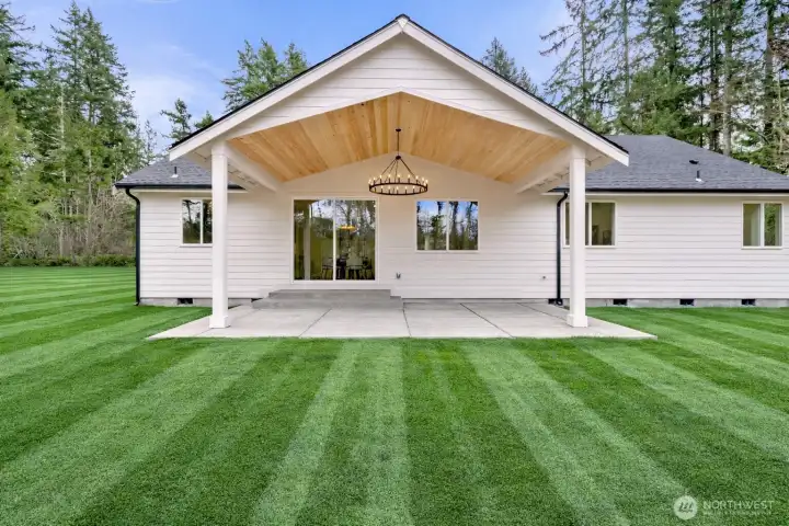 Covered back patio. Virtually landscaped, will be hydroseeded.
