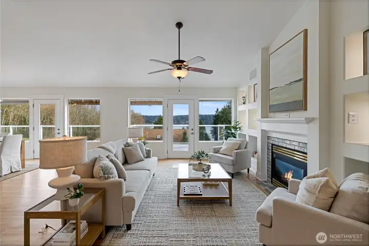 Relax in front of the gas fireplace on cool evenings.  French doors lead out to the huge deck for enjoying the views and a beverage or two!