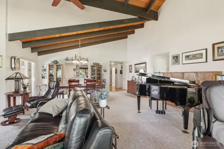 Large enough to comfortably host a grand piano, full dining set, and generous media seating.