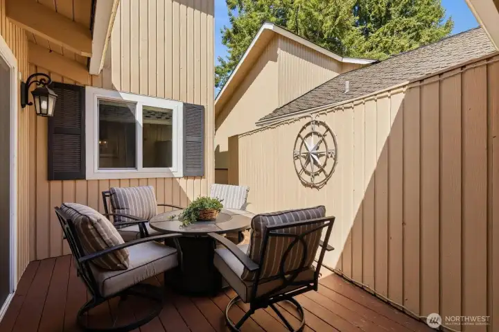 Recently painted back deck offers two distinct areas for relaxation and fairway viewing.