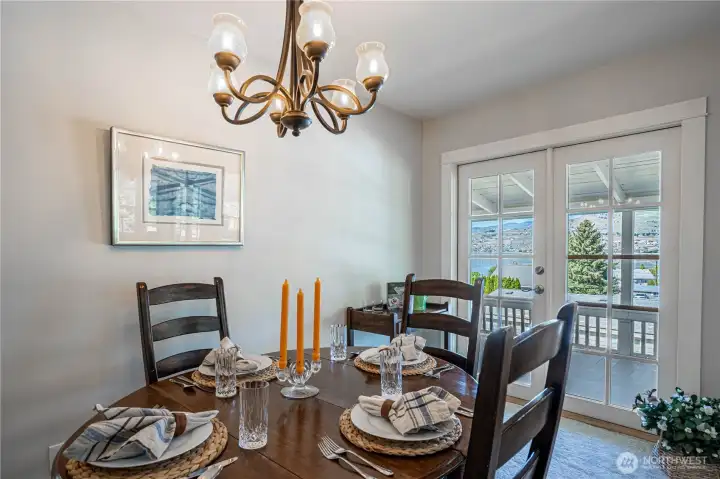 Quaint dining area with Frenche Door to deck