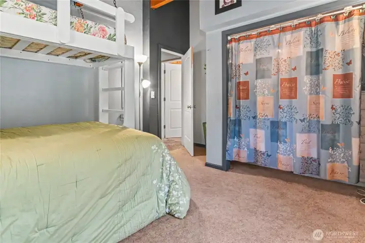 Bedroom #2 with large closet including shelving.