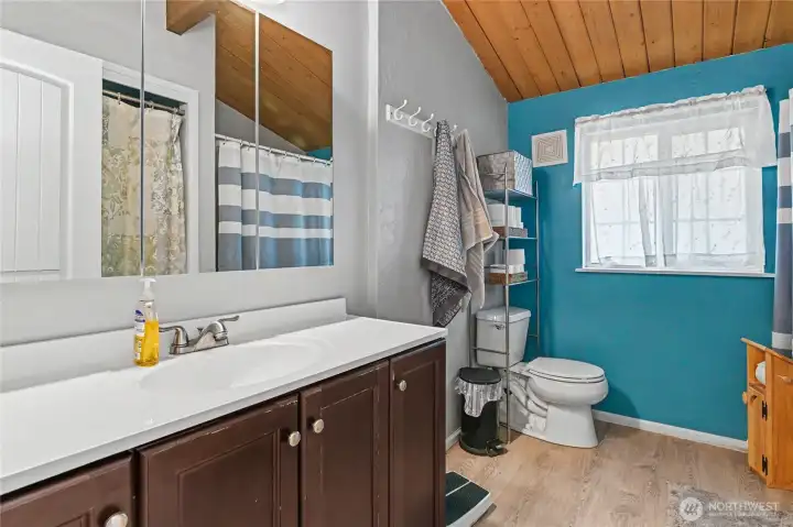 Upstairs full bath with tub.