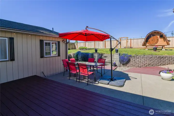 Patio area sits between the home and the detached garage.
