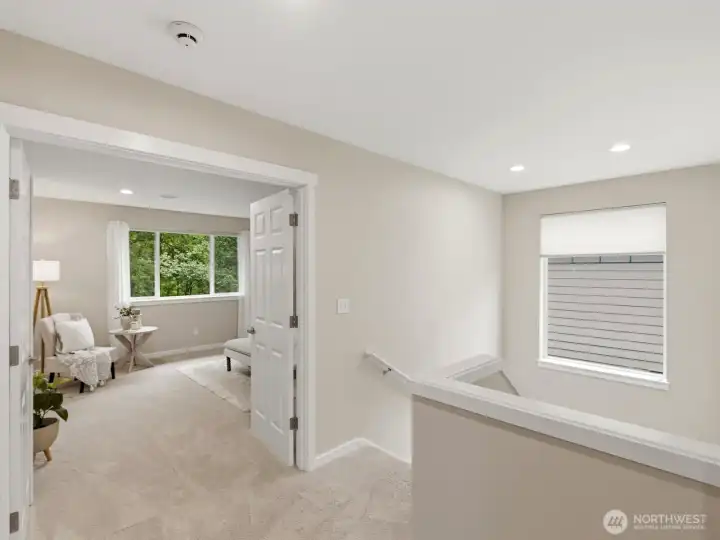 Open upper-level landing creating a sense of space and connection. Open upper-level landing creating a sense of space and connection.