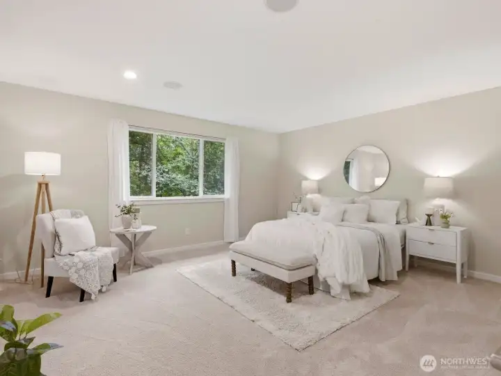 The serene primary suite overlooks a peaceful natural setting. The serene primary suite overlooks a peaceful natural setting.